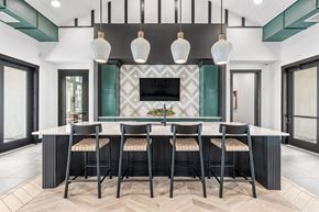Leander apartment for rent - a dining room with a table and chairs and a tv
