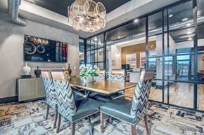 Roanoke apartment for rent - A modern dining room with a wooden table and chairs.