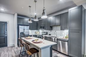 Roanoke apartment for rent - A modern kitchen with a dining table set for two.