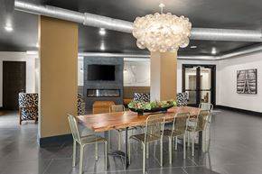 Roanoke apartment for rent - A modern dining room with a wooden table and chairs.