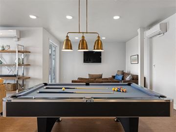 Tacoma apartment for rent - a pool table in a living room with a tv