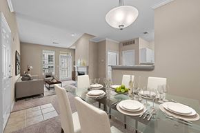 Atlanta apartment for rent - a dining room with a glass table and chairs