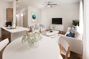 Houston apartment for rent - A modern living room with a white table and chairs.