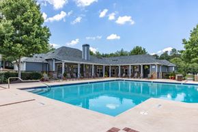Morrisville apartment for rent - a swimming pool with a house in the background