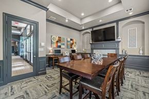 Plano apartment for rent - a dining room with a table and a tv