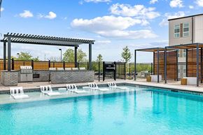 Westminster apartment for rent - a swimming pool with lounge chairs next to a building