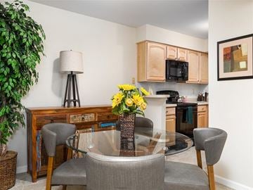 Chesterfield townhouse for rent - a living room with a table and chairs and a kitchen