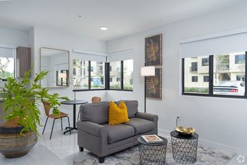 Hialeah apartment for rent - a living room with a couch and a table