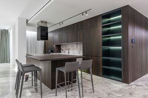 San Francisco apartment for rent - A modern kitchen with a bar area and grey chairs.
