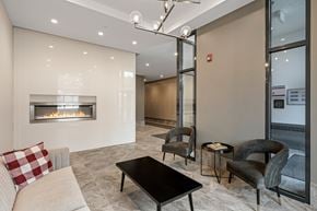 Stittsville apartment for rent - A modern living room with a fireplace and comfortable seating.