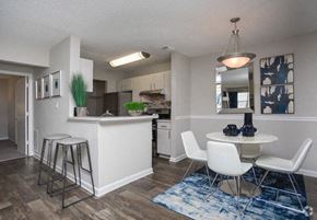 Ellenwood apartment for rent - a kitchen and dining room with a table and chairs