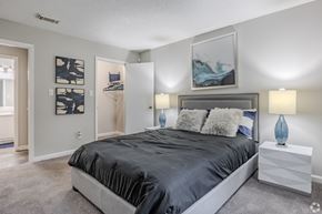 Ellenwood apartment for rent - a bedroom with a large bed and a closet