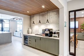 Kalamazoo apartment for rent - a kitchen with stainless steel cabinets and a counter with a coffee machine and a microwave