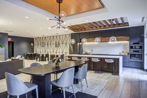 Kalamazoo apartment for rent - a large dining room with a table and chairs and a kitchen