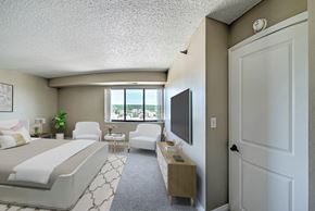 Kalamazoo apartment for rent - a hotel room with a bed and a tv in it