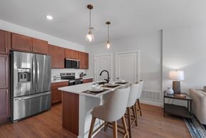 Plymouth apartment for rent - Kitchen with an island at The Landing at Hub City, Plymouth, WI