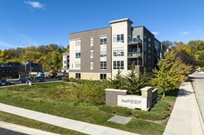 Wauwatosa apartment for rent - an apartment building with a construction site and a sign in front