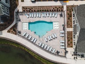 Oconomowoc apartment for rent - an aerial view of a swimming pool with lounge chairs around it