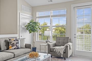 Oconomowoc apartment for rent - a living room with a couch and a coffee table and a window