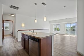 Oconomowoc apartment for rent - A kitchen with a wooden counter and a dishwasher.