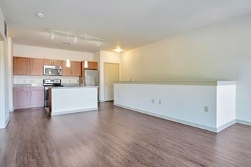 Wauwatosa apartment for rent - A kitchen with a white counter and wooden floors.