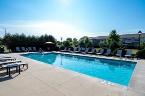 Oconomowoc apartment for rent - A pool with a blue water and a sign that says "NO DIVING".