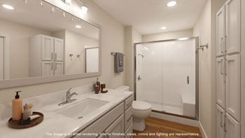 A bathroom with a sink and a toilet and a shower