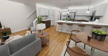 An open living room and kitchen with a table and chairs