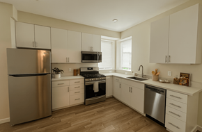 Rohnert Park apartment for rent - A kitchen with white cabinets and a stainless steel refrigerator.at Bella Creek, ROHNERT PARK, CA 94928
