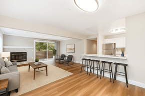 Novato apartment for rent - A living room with a fireplace and a bar area.at Posada West, Novato California