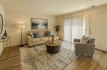 Novato apartment for rent - A living room with a couch, a coffee table, and a painting on the wall.