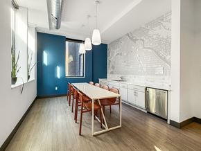 Minneapolis apartment for rent - A dining room with a long table and chairs.