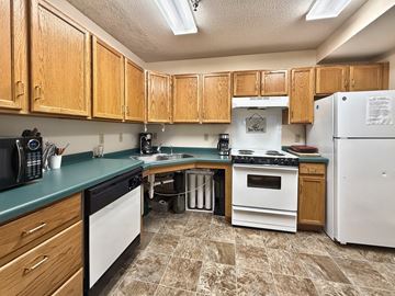 Minnetonka apartment for rent - A kitchen with wooden cabinets and a white refrigerator.