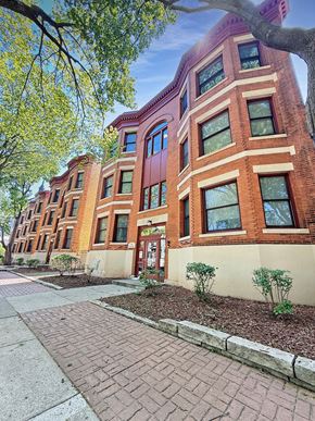 St. Paul apartment for rent - A red brick building with a tree in front.