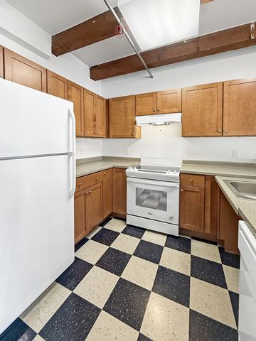 St. Paul apartment for rent - A kitchen with black and white checkered floor.