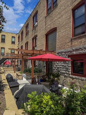 St. Paul apartment for rent - A patio and red umbrella at 653 Artists Lofts