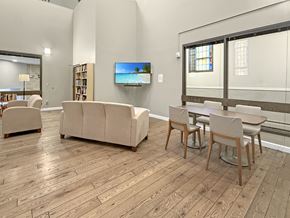 Minneapolis apartment for rent - A living room with a couch, chairs, and a television.