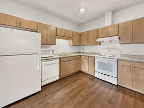 Eden Prairie apartment for rent - A typical kitchen at Trail Point Ridge Apartments with modern cabinetry and clean white appliances including dishwasher
