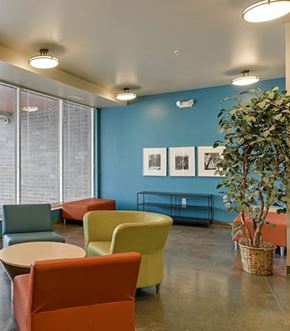 Minneapolis apartment for rent - A room with blue walls and a large window with blinds.