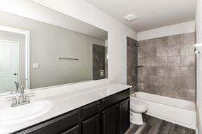 Dripping Springs townhouse for rent - a bathroom with a toilet sink and bathtub