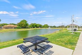 Waxahachie townhouse for rent - the preserve at ballantyne commons park benches next to a pond