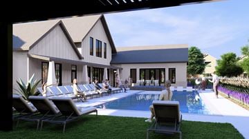 Crowley townhouse for rent - A pool area with lounge chairs and a building in the background.