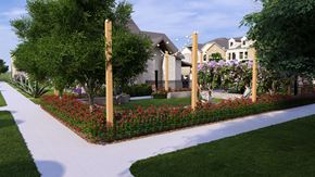 Crowley townhouse for rent - A garden with a white pathway and a variety of flowers.