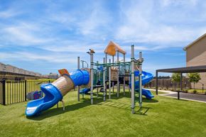 Montgomery townhouse for rent - A playground with a blue slide and a yellow tower.