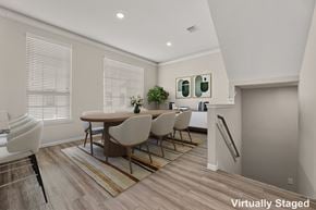 Houston townhouse for rent - A dining room with a table and chairs.