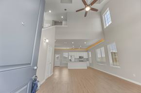 La Marque townhouse for rent - A spacious room with a ceiling fan and a window.
