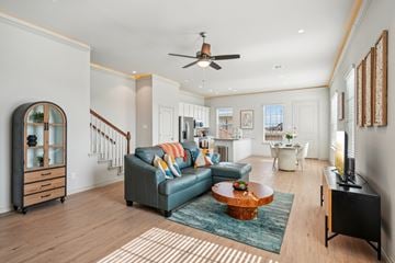 Red Oak townhouse for rent - A living room with a blue couch and a wooden coffee table.