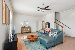 Red Oak townhouse for rent - A living room with a blue couch and a wooden coffee table.