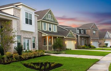 Texas City townhouse for rent - A row of houses with a well-maintained lawn in front.