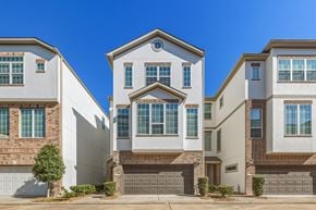Houston townhouse for rent - A row of modern houses with garages in front.